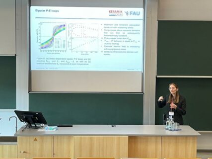 Juliana Maier giving a talk about the topic “Stress-induced tailoring of energy storage properties in lead-free Ba0.85Ca0.15Zr0.1Ti0.9O3